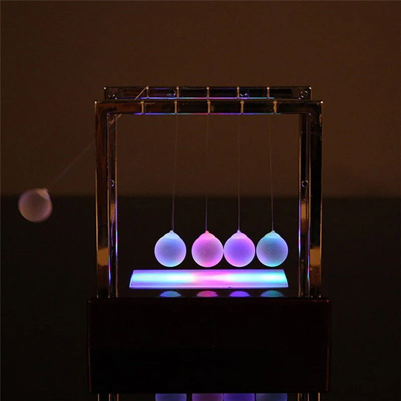 Newton’s Cradle LED Light-Up Kinetic Energy Toy – Home & Office Decor  لعبة نيوتن المضيئة بالطاقة الحركية – ديكور للمكتب والمنزل