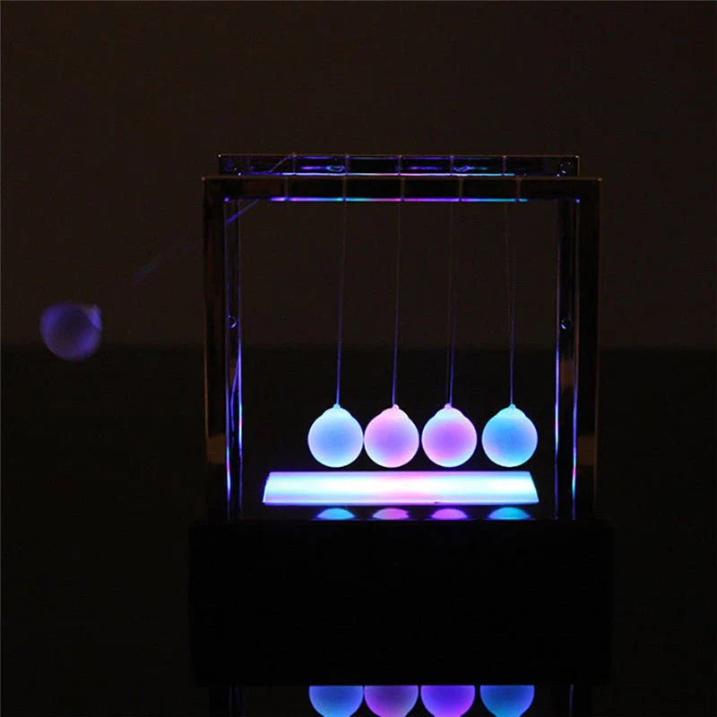 Newton’s Cradle LED Light-Up Kinetic Energy Toy – Home & Office Decor  لعبة نيوتن المضيئة بالطاقة الحركية – ديكور للمكتب والمنزل